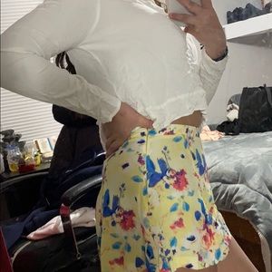 White shirt and yellow floral skirt